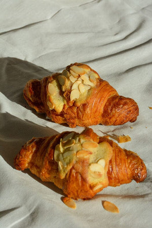
                  
                    Load image into Gallery viewer, Flavored Croissants - MKT PopUp The Daily Knead Twice-Baked Almond 
                  
                