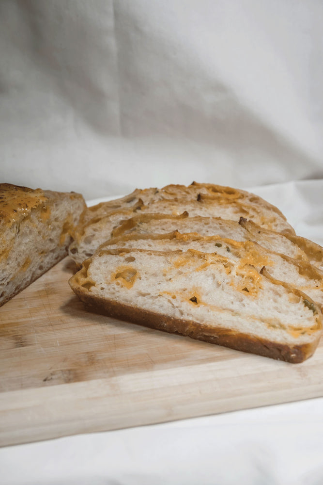 
                  
                    Load image into Gallery viewer, Sourdough Cheddar Jalapeño Bread The Daily Knead Bakery 
                  
                